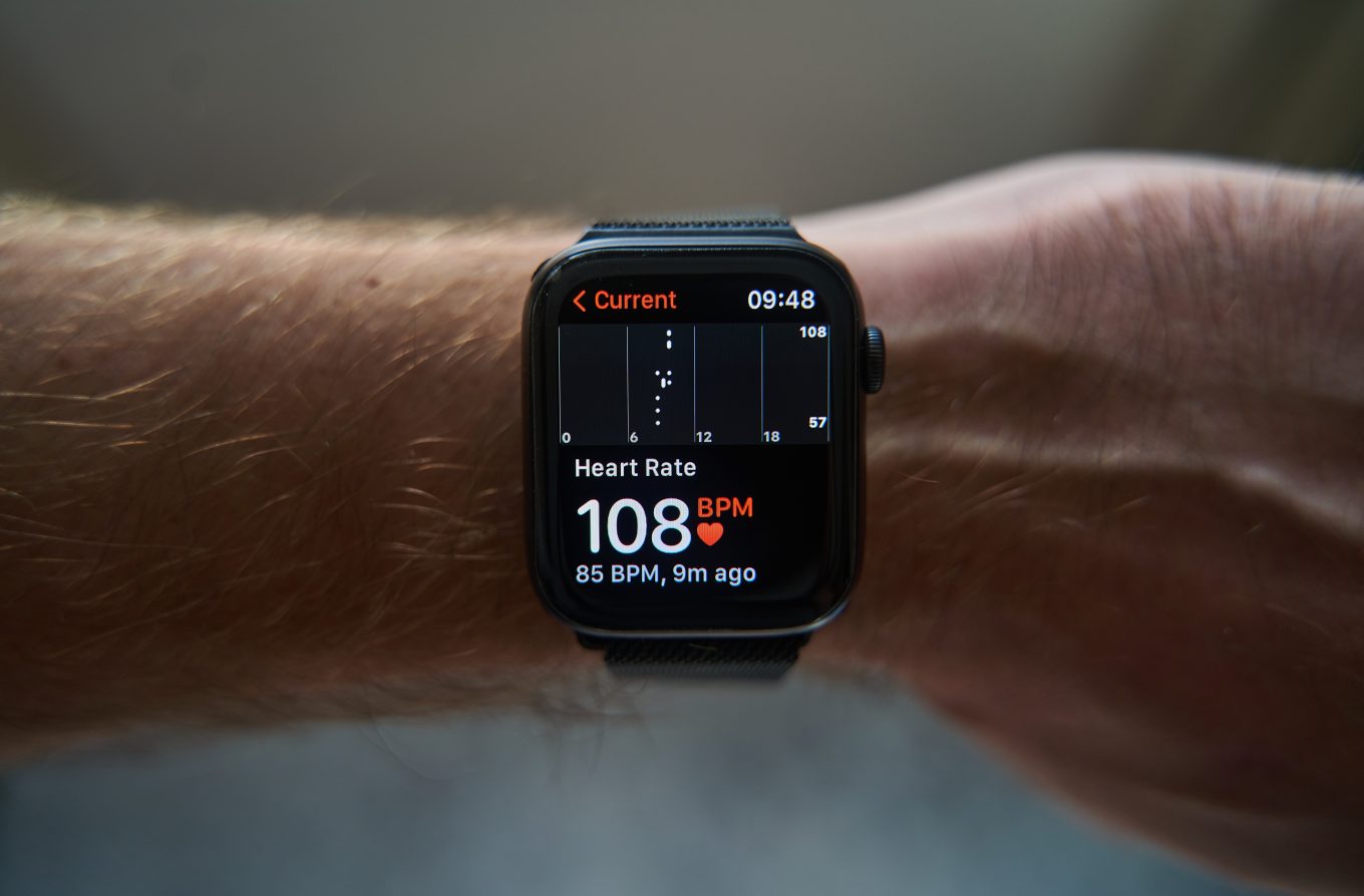 Book Combinations of Tests 1 An Apple Watch worn on the wrist displays heart rate data, used for calculating calorie expenditure.